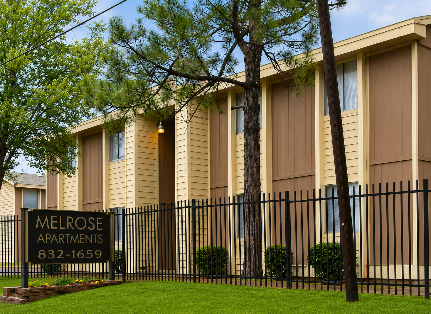 Exterior and sign at Melrose Apartments